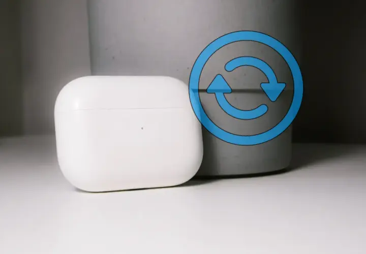 Białe etui AirPods z niebieską ikoną resetowania.